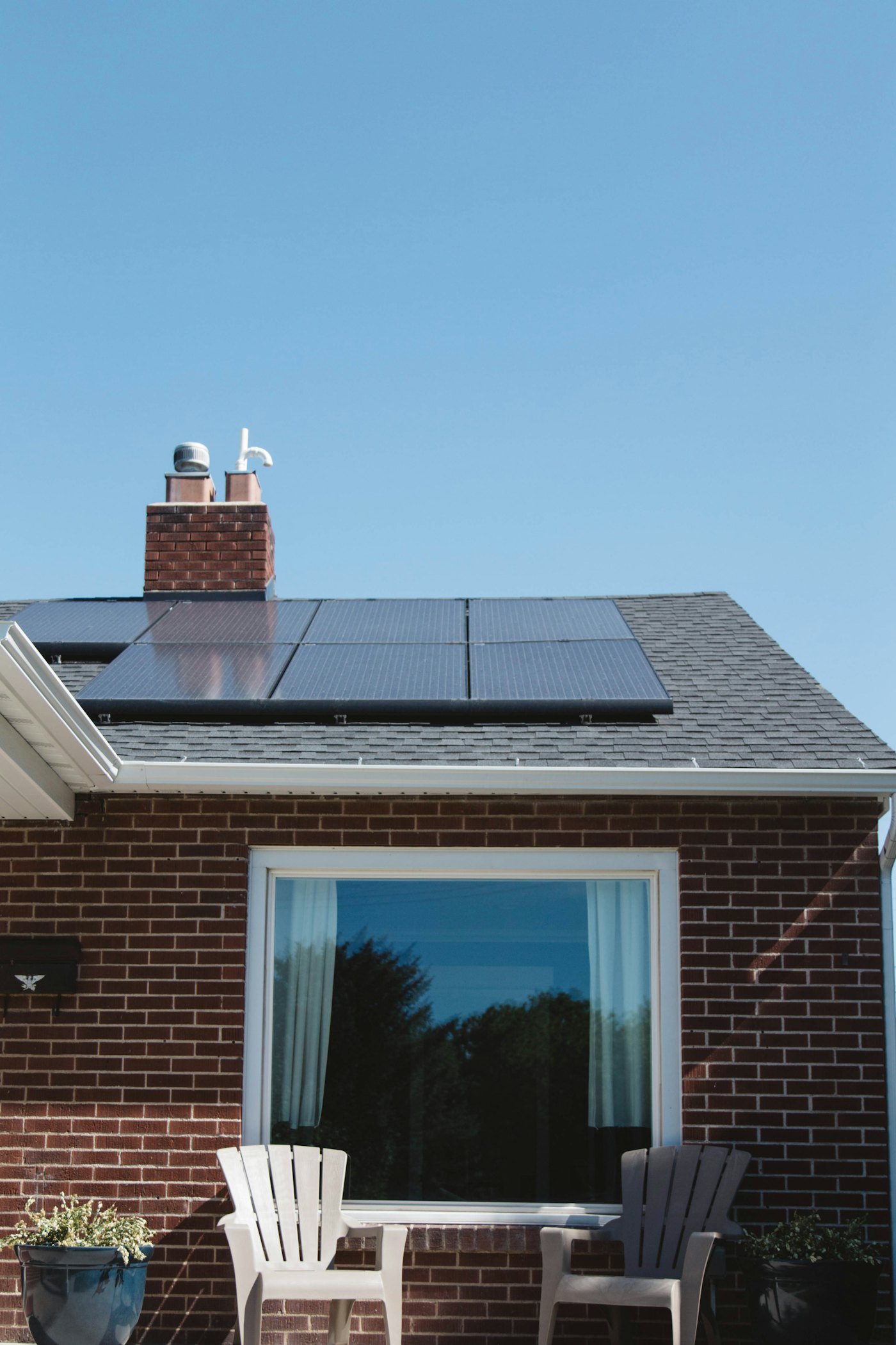 Brick home with solar panels on the roof