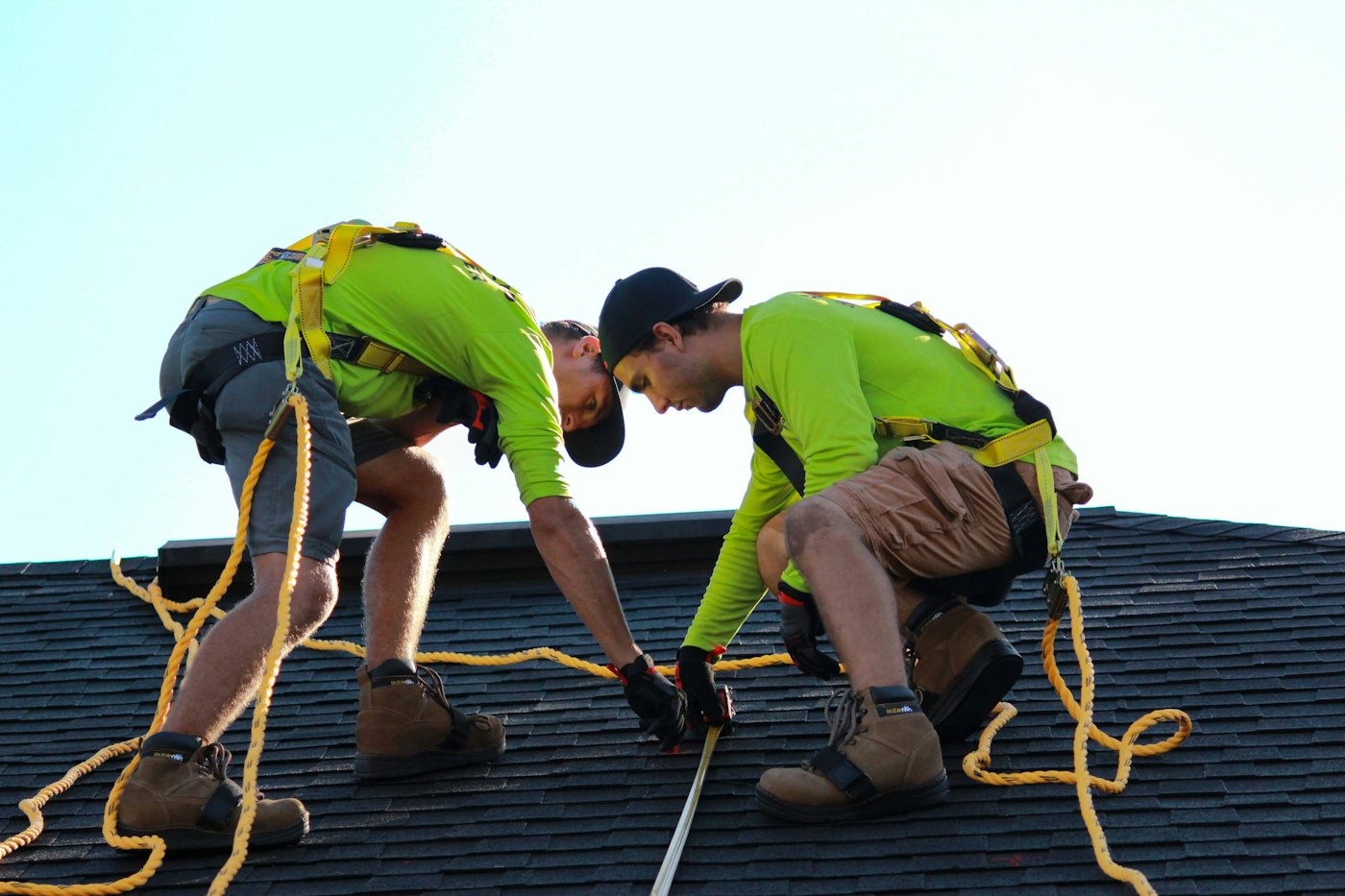 Technicians working on a residential roof