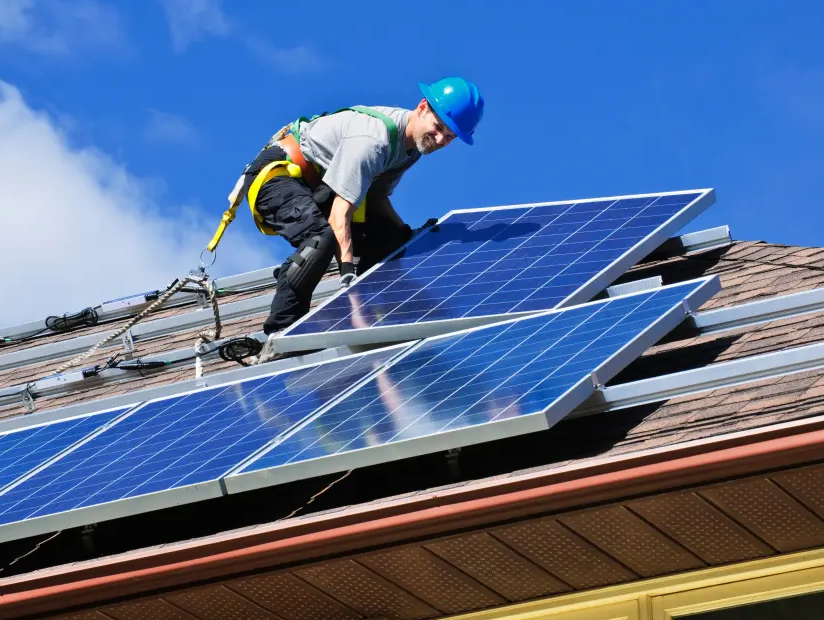 Technician working on a residential solar array